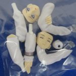 袋に入った交換用の顔と腕のパーツ。