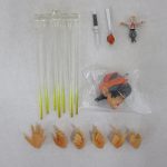 付属品一式。黄色いエフェクトパーツ、ナイフ、袋入りの交換用頭部、交換用手首6個。