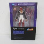 figma 八神庵 SP-095の外箱表面。紫の背景に、窓から見える本体と付属パーツ。