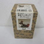 妖怪フィギュアコレクション「九尾の狐」の外箱。松の柄のクラフト箱に商品写真の帯が巻かれています。