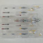 ブリスターに入ったコスモゼロ本体とミサイルなどのパーツ