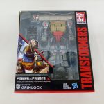 外箱の正面。窓の中の本体と「DINOBOT GRIMLOCK」「AGE 8+」の表記が写っています。