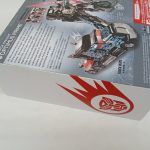 外箱の側面。トラック形態の写真と「BLACK KNIGHT OPTIMUS PRIME」「TRUCK MODE」の印字。