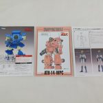 外箱、説明書、キャラクターの解説シートを並べた様子。「ATH-14-WPC」の文字が写っています。