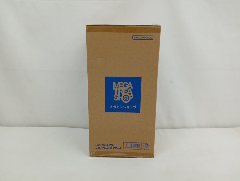 茶色の輸送箱の正面。青い「メガトレショップ」のロゴがあります。