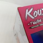 外箱の角のアップ。ロゴの下に『光月モモの助 -双龍図-』の表記