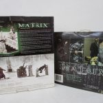 2つのパッケージの背面。左の箱に MATRIX SERIES ONE DELUXE BOXED SET の説明があります。