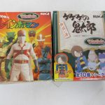 2つの箱の正面。左の箱に 愛の戦士 レインボーマン と Tinibiz の印字があります。