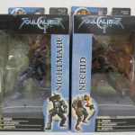2つの箱の正面。右の NECRID の箱にオレンジ色の戦士が見えます。