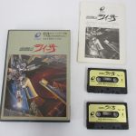 箱と説明書、カセットテープ2本を並べて撮影。箱に 地球戦士ライーザ と ENIX の印字があります。