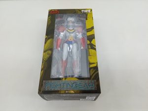 外箱の正面。窓からテッカマンのフィギュアが見え、『FIGHTING GEAR』のロゴと千値練のロゴ