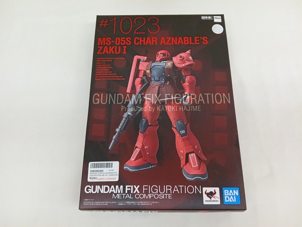 外箱の正面。『#1023 MS-05S CHAR AZNABLE'S ZAKU I』の文字と赤いザクの写真、『GUNDAM FIX FIGURATION METAL COMPOSITE』のロゴ