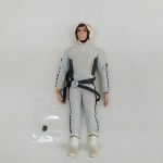 ウルトラ警備隊の隊員服を着た人形の全身。横に小さな部品の入った袋