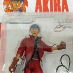 パッケージ正面上部の寄り。金田の顔と付属のゴーグル