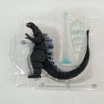 ブリスターに入ったゴジラ本体と熱線エフェクトパーツ、スタンドの棒