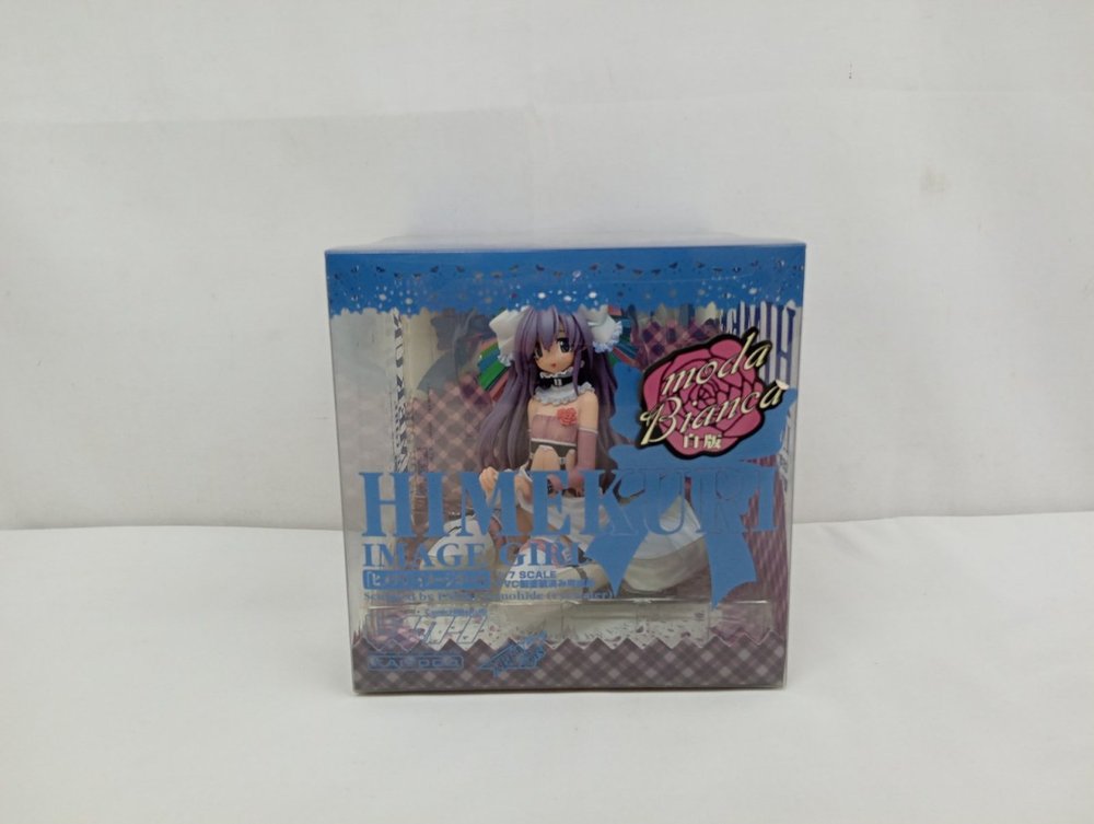 透明なケース入りの箱の正面。HIMEKURI IMAGE GIRL の文字と moda Bianca 白版のシール