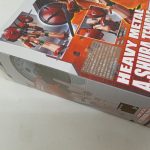 外箱を斜めから写した様子。『HEAVY METAL A.SHURA TEMPLE』の文字と商品写真